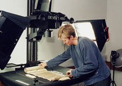 Rachel Roberts photographing a Dunhuang manuscript